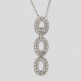 Sterling silver semi mount pendant setting with white topaz halo and three oval stones.